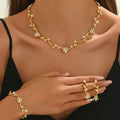 Maison Veyre Gold Floral Jewelry Set — Necklace, Earrings, Bracelet & Ring